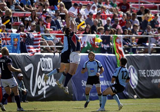 Zach Test, center, (#5) of the USA catches a ball in a game against Uruguay during the 2011 USA Sevens Rugby World Series at Sam Boyd Stadium Sunday, February 13, 2011. The USA team won a 27-7  victory over Uruguay, then beat Japan 19-12 to win the Shield final.