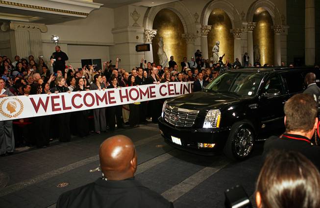 Employees hold a welcome banner as Celine Dion arrives at Caesars Palace in Las Vegas on Feb. 16, 2011. The singer begins a new series of shows at The Colosseum at Caesars Palace on March 15.