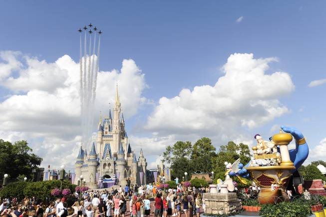 In this publicity image released by Disney, the U.S. Air Force Thunderbirds fly over the Magic Kingdom on Tuesday, Oct. 26, 2010, in Lake Buena Vista, Fla.  The special flight over Walt Disney World commemorated the start of "Air Force Week" which runs through Oct. 31.
