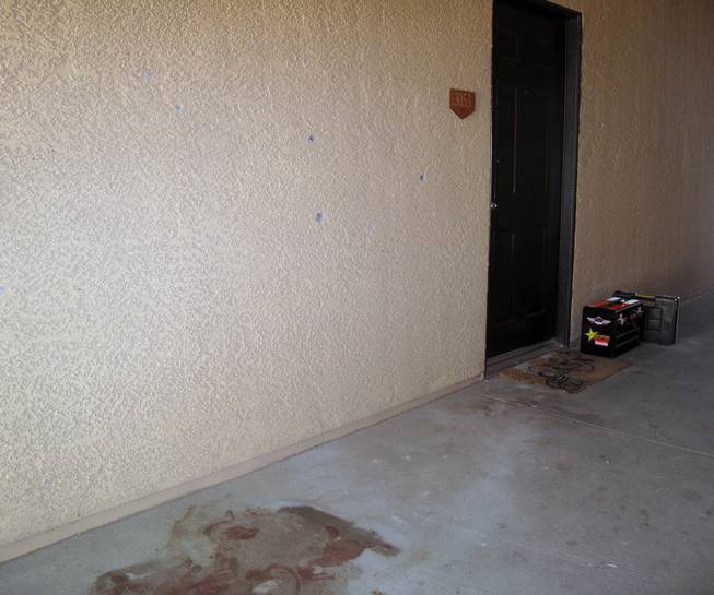 Bullet holes and a blood stain are visible on the third floor of a building within the Broadstone Montecite Apartments complex on Grand Teton Drive, where a gunman was shot and killed by Metro Police after firing at officers. 