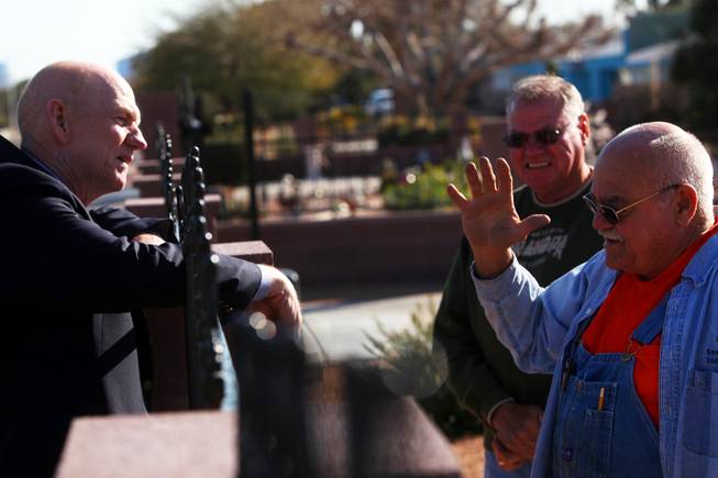 Las Vegas mayoral candidate and county Commissioner Larry Brown (left) talks with Glen Beckner (right) and Maurice Beckner as he campaigns door to door on Lacy Lane in Las Vegas on Thursday, Feb. 24, 2011.