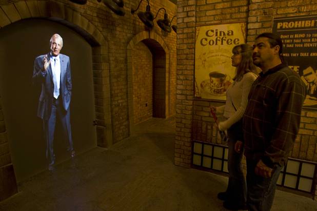 Candice Rodriguez and Sergio Tamez listen to virtual guide James Caan during a preview of the Las Vegas Mob Experience at the Tropicana on Tuesday, March 1, 2011.