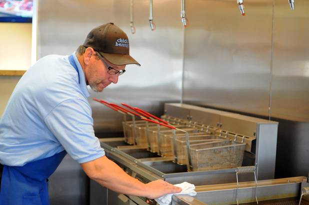 Co-owner Mark Goldenberg cleans the deep fryers on Tuesday, March 1, 2011, at his new Parisian-Texan eatery, Chicks and Benny's, located in Henderson. 