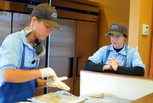 Denise Goldenberg watches her daughter Nicci Goldenberg prepare French beignet puff pastries in the kitchen of their new Henderson eatery, Chick and Benny's, on Tuesday, March 1, 2011.