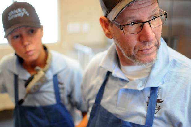Mark Goldenberg and his daughter Nicci Goldenberg survey the dining area from the kitchen in their new eatery, Chick and Benny's on Tuesday, March 1, 2011. 