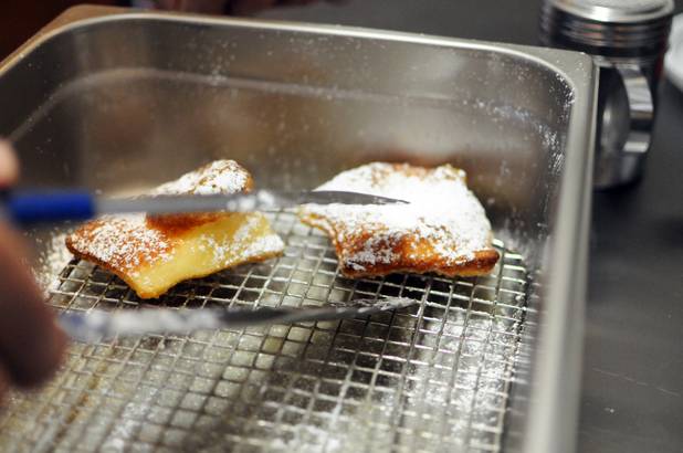 Co-owner Mark Goldenberg scoops up French beignets in the kitchen of his new Henderson eatery, Chick and Benny's, on Tuesday, March 1, 2011.  