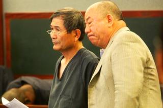 Hiroyuki Yamaguchi (left) makes an appearance in Las Vegas Justice Court Tuesday, March 1, 2011. Yamaguchi is charged in connection with the robbery at the Rio Thursday, Feb. 28, 2011.
