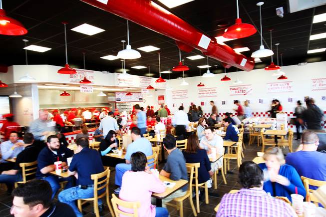 Customers dine on burgers and fries on opening day at Five Guys Burgers and Fries in Henderson, which opened Wednesday, March 2, 2011. Three more locations are scheduled to open in the Las Vegas Valley in the coming weeks.