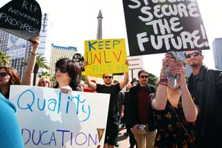 Protesters make their way along Las Vegas Boulevard during a protest against education budget cuts Sunday, March 6, in front of the Bellagio on the Las Vegas Strip.