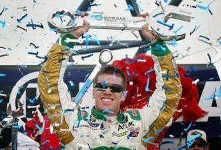 Carl Edwards (99) celebrates in Victory Lane after winning the Kobalt Tools 400 NASCAR Sprint Cup Series auto race at the Las Vegas Motor Speedway Sunday, March 6, 2011. 