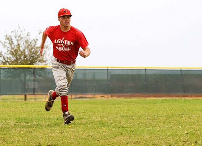 Mark Gederos, a pitcher on the Arbor View High School baseball team, runs during practice at the school Thursday, March 17, 2011. Gederos is successful as a player despite only having a finger and thumb on his right hand and a prosthetic right foot.
