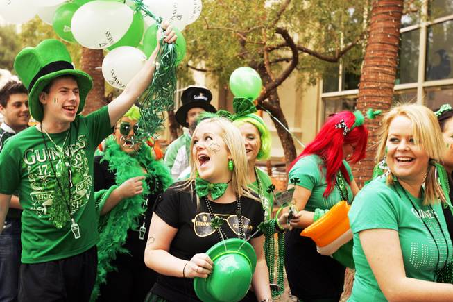 Ri Ra Irish Pub employees have fun while parading through Mandalay Beach toward the new pub in the Shoppes at Mandalay in Las Vegas during St. Patrick's Day Thursday, March 17, 2011.