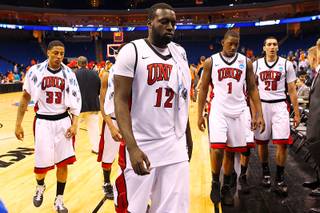 UNLV players, from left, Tre'Von Willis, Brice Massamba, Quintrell Thomas and Karam Mashour leave the court after their game against Illinois in the second round of the NCAA basketball championships Friday, March 18, 2011, at the BOK Center in Tulsa. Illinois won the game 73-62.