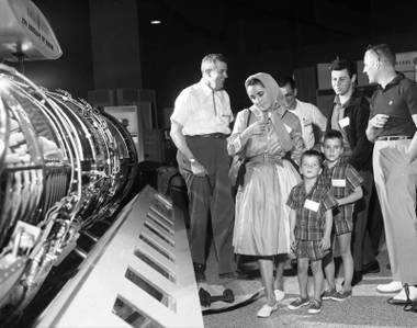 Elizabeth Taylor, with her sons Michael Howard Wilding and Christopher Edward Wilding, and Eddie Fisher at the World Congress of Flight convention at the new Las Vegas Convention Center on April 11, 1959. 