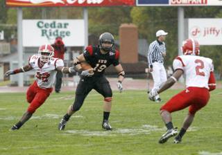 Coronado High graduate Tysson Poots looks for yardage after a catch during his college career at Southern Utah. Poots is preparing for the April NFL Draft.