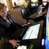 Cindy Clark plays a slot machine at Dotty's near Eastern and Serene in Henderson on Thursday, March 24, 2011.