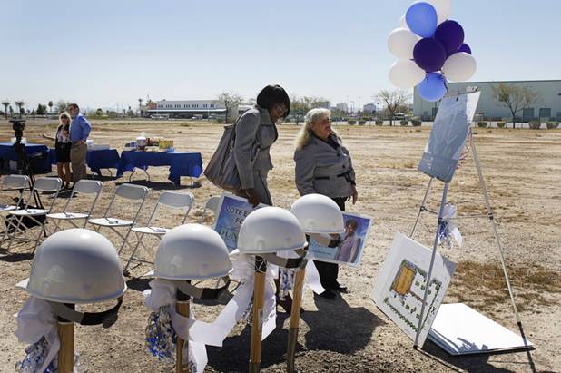 Katherine Duncan, left, candidate for Las Vegas Mayor, and campaign volunteer Nancy Forman look over an artist's illustration of the Nevada Health Centers' Martin Luther King Health Center and Administrative Office building near Martin Luther King and Lake Mead boulevards before a groundbreaking ceremony for the facility Monday, March 28, 2011.