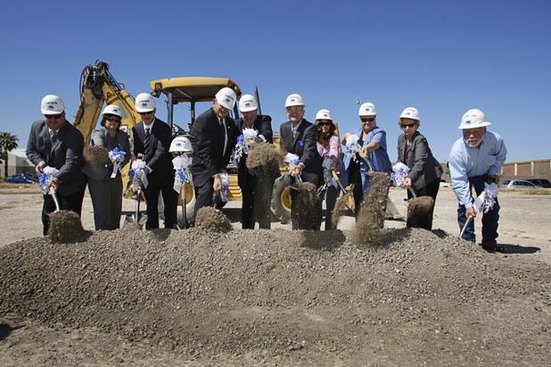 Officials and guests turn over dirt during the groundbreaking for the Nevada Health Centers' Martin Luther King Health Center and Administrative Office building near Martin Luther King and Lake Mead boulevards Monday, March 28, 2011.
