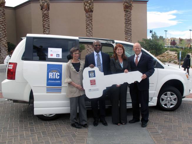 The Regional Transportation Commission hands off a ceremonial key to Easter Seals and ITNLasVegasValley, which will provide paratransit service for parts of Henderson. From left: ITN co-director Fran Smith, Easter Seals Board Chair Karl Armstrong, Henderson City Councilwoman Debra March and RTC General Manager Jacob Snow.