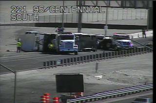 A traffic camera shows crews trying to upright a truck and trailer that overturned on U.S. 95 near the northern Las Vegas Beltway Thursday afternoon. The crash closed northbound U.S. 95.