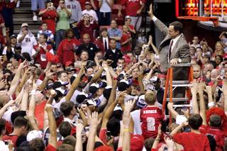 UNLV coach Lon Kruger waves to fans after cutting down the net following UNLV's 78-70 win over BYU in the Mountain West Conference championship game Saturday, March 10, 2007.