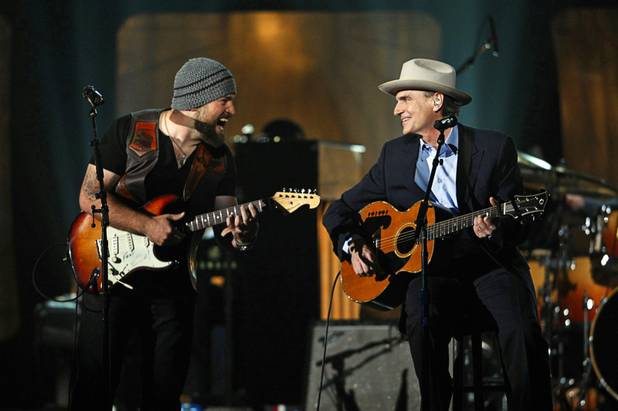 Zac Brown, left, and James Taylor perform a medley during the 46th annual Academy of Country Music Awards at the MGM Grand Garden Arena Sunday, April 3, 2011. 
