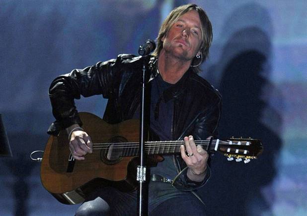 Singer Keith Urban performs "Without You" during the 46th annual Academy of Country Music Awards at the MGM Grand Garden Arena Sunday, April 3, 2011. 