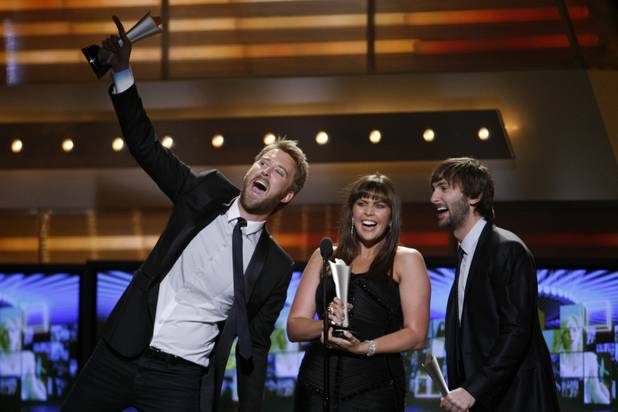 Charles Kelley, left, Hillary Scott, center, and Dave Haywood, of the band Lady Antebellum, accept the award for Vocal Group of the Year  the 46th annual Academy of Country Music Awards at the MGM Grand Garden Arena Sunday, April 3, 2011. 