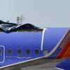 A Southwest Airlines plane sits in a remote area of the Yuma International Airport, after the plane had a section of fuselage tear from the plane during a flight on Friday, seen here Monday, April 4, 2011, in Yuma, Ariz. 