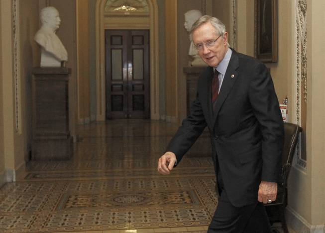 Senate Majority Leader Harry Reid leaves the Senate floor on Capitol Hill after announcing an agreement to avoid a government shutdown Friday, April 8, 2011 in Washington.