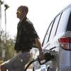 Kurtis Keeler of Jamestown, N.Y., fills up at a gas station on Blue Diamond Road Thursday, April 14, 2011. 