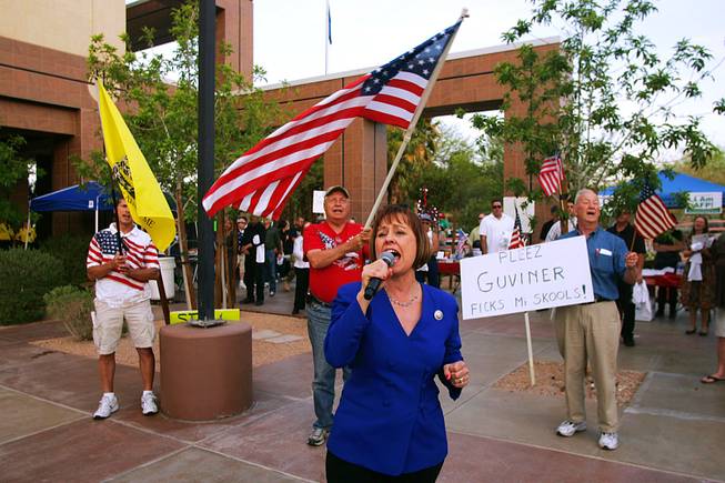 Sharron Angle belts out Lee Greenwood's "God Bless the U.S.A." during a tax day Tea Party rally sponsored by Tea Party & Republicans Uniting Nevada Conservatives and Americans for Prosperity Friday, April 15, 2011, at the Grant Sawyer Building.