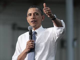 President Barack Obama gesture during a town hall meeting to discuss reducing the national debt, Thursday, April 21, 2011, at ElectraTherm, Inc. in Reno.
