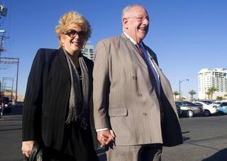 Mayor Oscar Goodman and his wife, Carolyn, candidate for mayor, walk from the Artifice lounge to the Bar+Bistro during a tour of new businesses in downtown Las Vegas Tuesday, April 26, 2011. Three businesses celebrated their grand openings - Renick Grocery in Soho Lofts on Las Vegas Boulevard, Artifice lounge, 1025 S. 1st St., and the Bar+Bistro in the Arts Factory. Another business, the Lady Sylvia bar in the Soho Lofts, is expected to open in about 30 days.