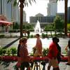 Tourists pass by the Flamingo with Caesars Palace in the background Thursday, April 28, 2011.