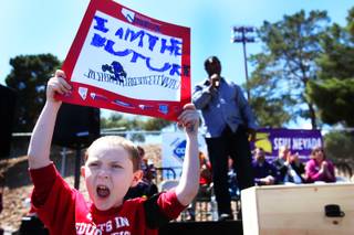 Alec Miller, 6, cheers as Nevada Senate Majority Leader Steven Horsford, D-North Las Vegas, addresses the hundreds gathered Saturday, April 30, 2011, at Cashman Field to protest proposed cuts to education.