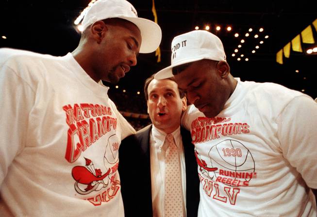 Former UNLV greats Stacey Augmon, left, and Larry Johnson are congratulated by Duke coach Mike Krzyzewski following the Rebel's 103-73 victory over the Blue Devils in the 1990 NCAA championship game in Denver, Colo. Augmon, who played in the NBA for 16 seasons and spent the last four as an assistant with the Denver Nuggets, will be joining former teammate Dave Rice's staff at UNLV as an assistant.