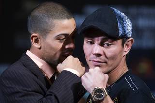 Super bantamweight boxer Wilfredo Vazquez Jr., left, of Puerto Rico speaks to Jorge Arce of Mexico as they pose during a news conference at the MGM Grand Thursday, May 5, 2011. Vazquez will defend his WBO super bantamweight title against Arce at the MGM Grand Garden Arena on Saturday.