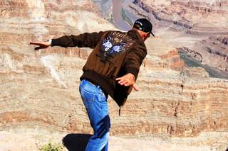 Yves Rossy, known as JetMan, poses for the media after it was announced that he would not be flying over Grand Canyon West. Rossy was cleared by the FAA on Friday morning but didn't feel ready do to lack of practice.