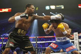Shane Mosley punches at Manny Pacquiao during their WBO welterweight title fight at the MGM Grand Garden Arena on May 7, 2011.