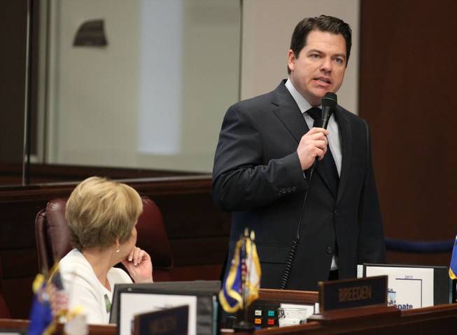 Nevada Sen. Michael Roberson, R-Henderson, speaks out against a Democratic redistricting plan during debate on the Senate floor Tuesday, May 10, 2011, at the Legislature in Carson City, Nev. The Senate passed the plan on a strict party-line vote. Sen. Shirley Breeden, D-Henderson, is at left.