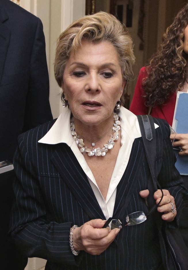 Senate Ethics Committee Chair Sen. Barbara Boxer, D-Calif., is pursued by reporters on Capitol Hill in Washington, Thursday, May 12, 2011, after speaking on the Senate floor about former Nevada Sen. John Ensign.