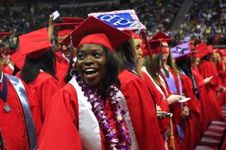 Kendra Jones smiles as she spots her family in the stands during UNLV's spring commencement ceremony Saturday, May 14, 2011 at the Thomas & Mack Center.