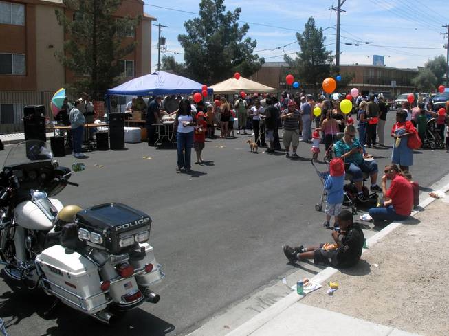 A crowd lines up to get free hot dogs Saturday at a block party sponsored by Metro Police. The block party and safety fair was on 14th Street near Fremont Street in downtown Las Vegas.