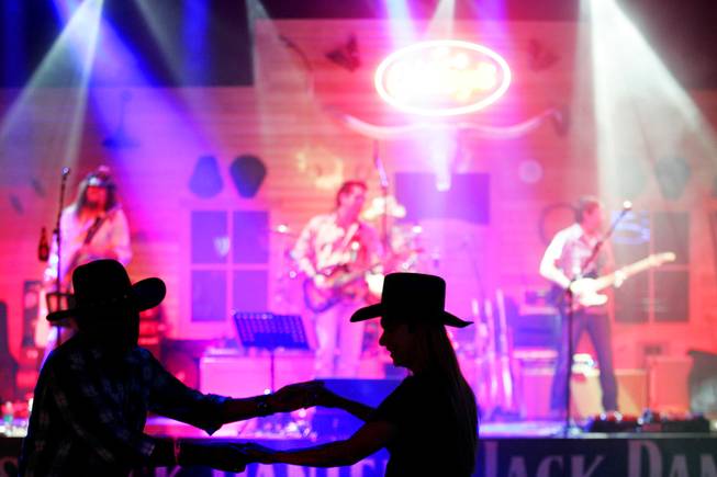 Dancers enjoy the live band at Gilley's Las Vegas inside Treasure Island Friday, May 27, 2011.
