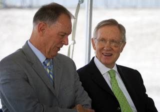 Randy Babbitt, left, Federal Aviation Administration administrator, and Sen. Harry Reid chat before a groundbreaking for a new $99 million FAA air traffic control facility at McCarran International Airport Tuesday, May 31, 2011. The facility is expected to be operational in early 2015.