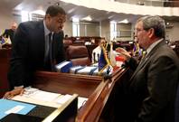 Senate Majority Leader Steven Horsford, D-North Las Vegas, and Minority Leader Mike McGinness, R-Fallon, talk on the Senate floor Monday, May 30, 2011, at the Legislature in Carson City. Lawmakers continue to work with the governor on the state budget, including talks to extend taxes that were set to expire June 30.