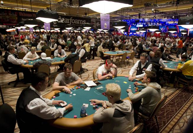 Players compete in a $25,000 Heads-Up poker tournament during the World Series of Poker at the Rio hotel and casino in Las Vegas, Tuesday, May 31, 2011.