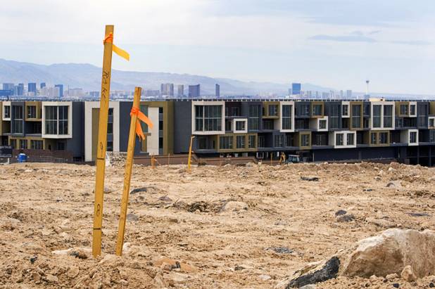 A survey stake is shown in an area being prepared for residential development near Horizon Ridge Parkway and Gibson Road in Henderson Wednesday, June 1, 2011. The defunct Vantage Lofts project is in the background.
