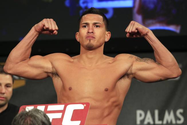 Anthony Pettis flexes during the weigh in for the TUF Season 13 fight card Thursday, June 2, 2011.